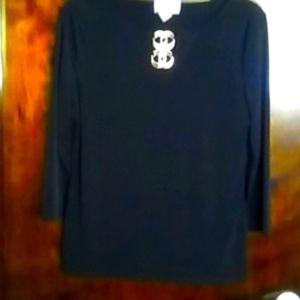 New black blouse size medium. Brand Carmen Marc Valvo. Beautiful detail in front